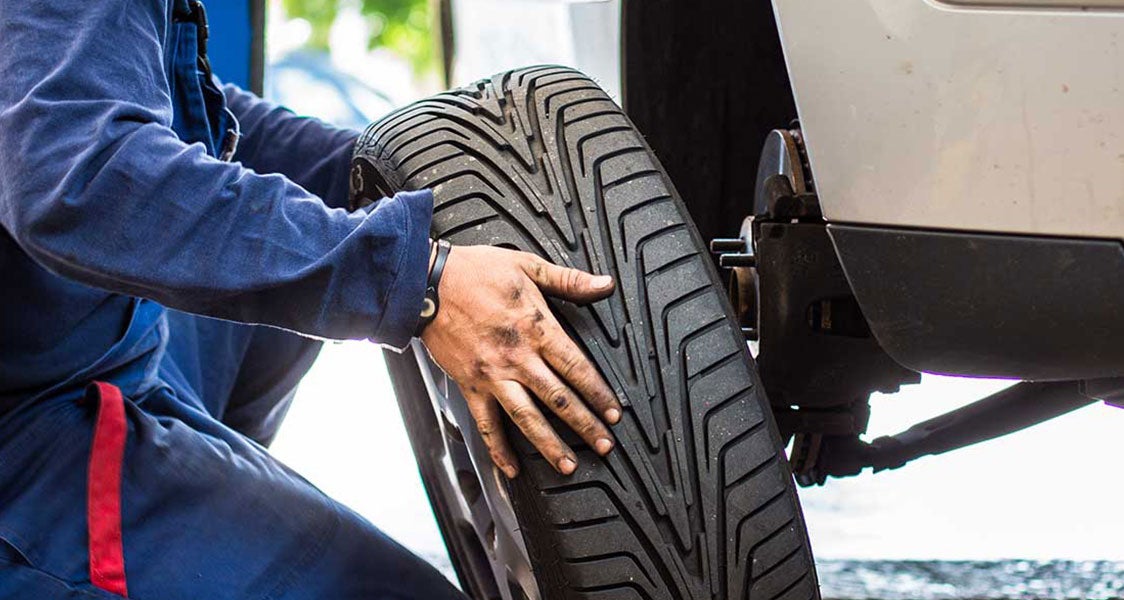 a tire being replaced on a car