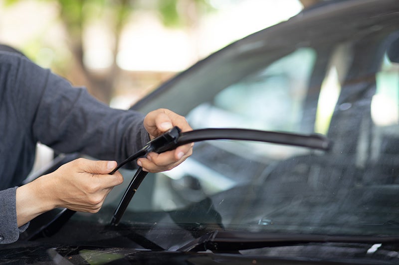 Windshield wipers being inspected