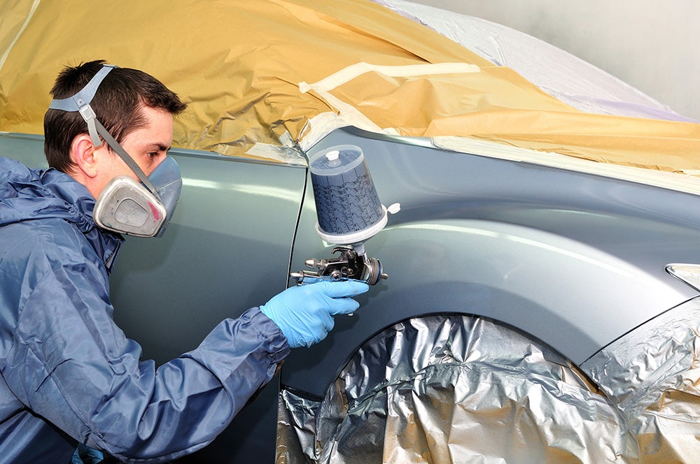 Car panel being painted